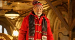 Arnold Schwarzenegger caracterizado como Santa Claus