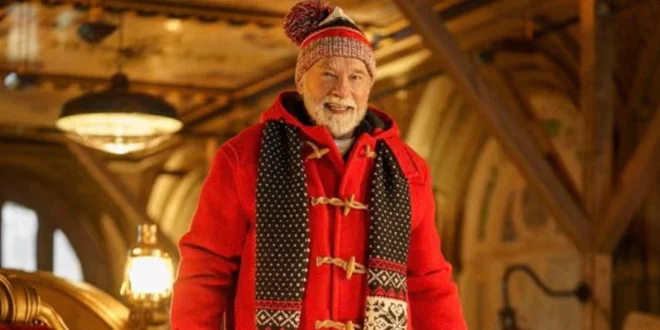 Arnold Schwarzenegger caracterizado como Santa Claus