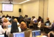 Funcionarios públicos participando en un taller de capacitación del MEF